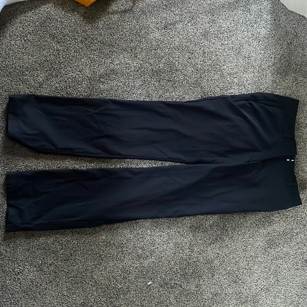 Nike women golf pants l. Size 4 barely worn.Will dry clean steam before shipping